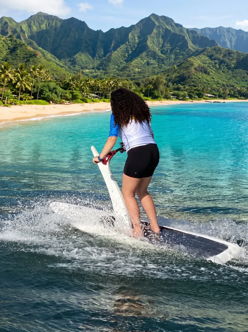 Hydro Fly hydrofoil rider gliding above Maui ocean water